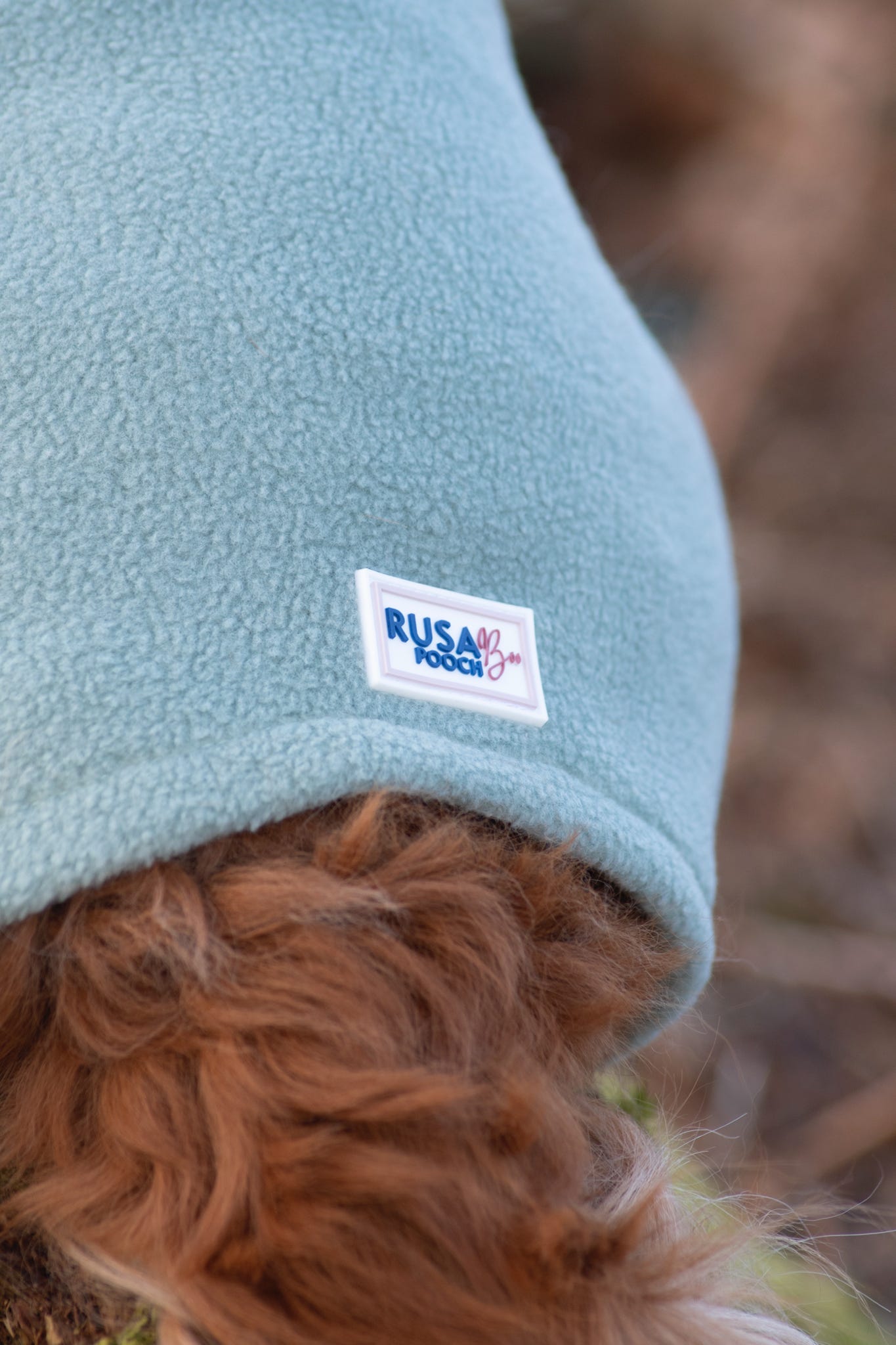 Close up of our branding tag on the back of a sage suit