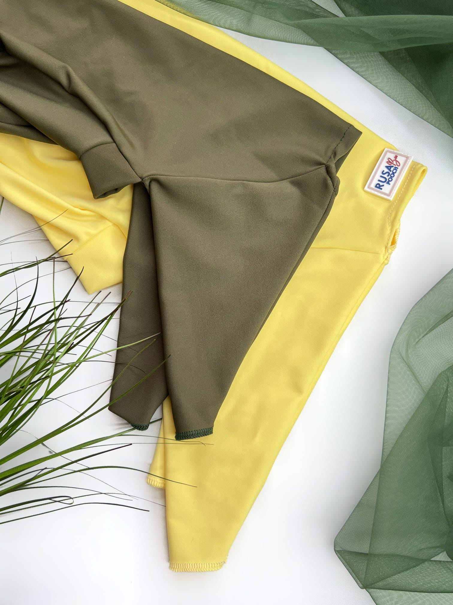 Close up of our green and yellow waterproof summer suits