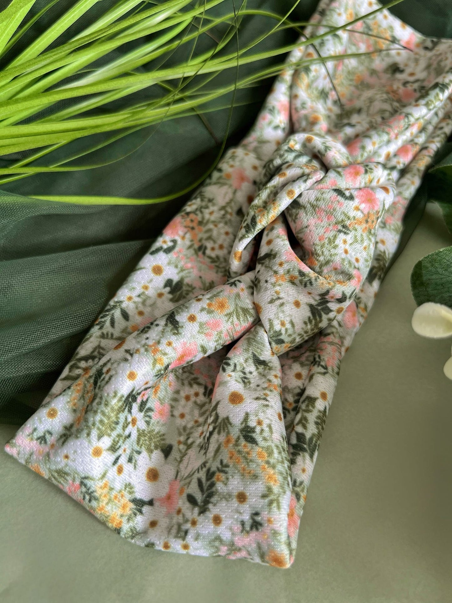 Close up of our green flowery women’s headband