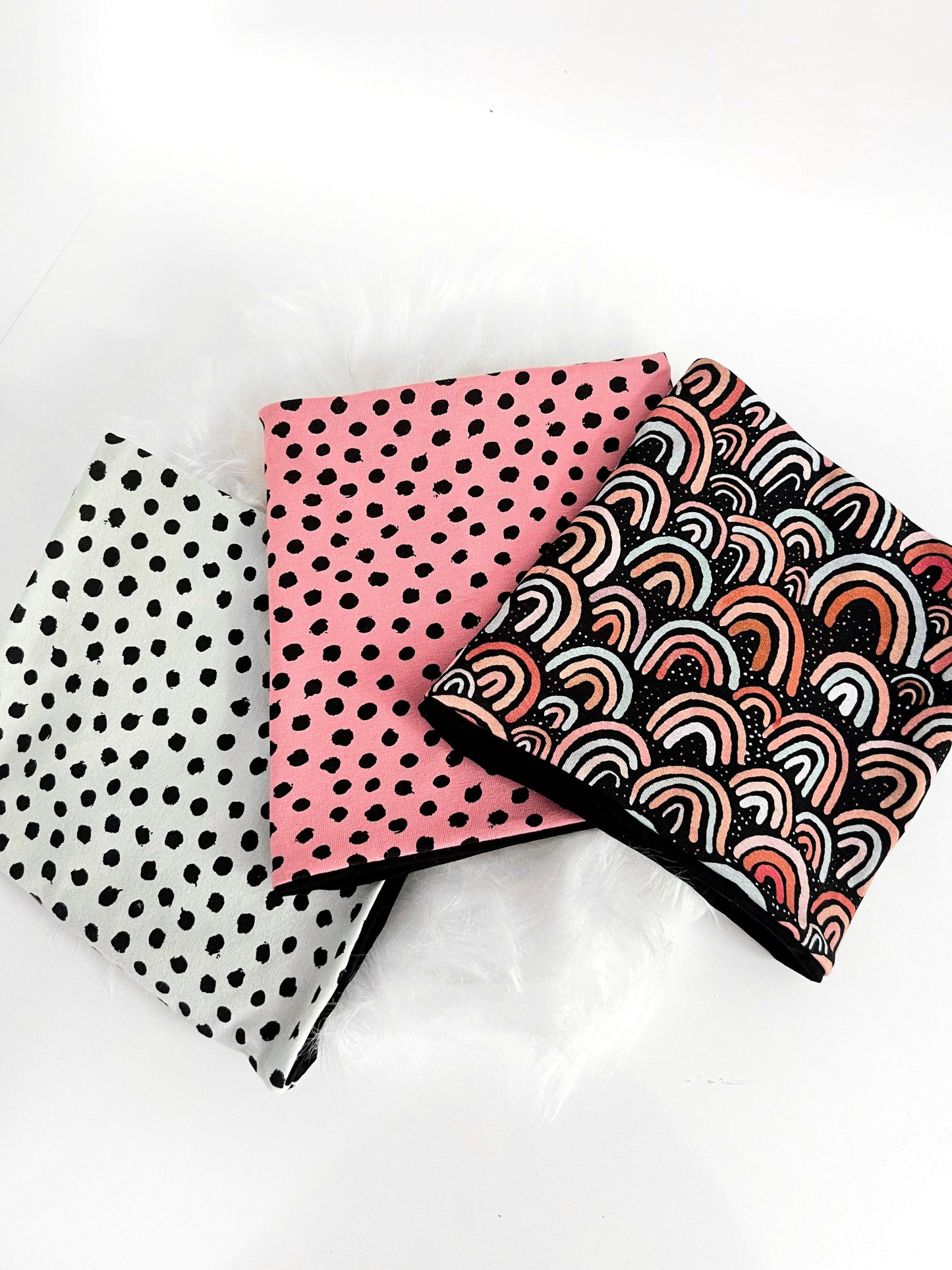 mint spotty, pink spotty and black raibow snoods - top view