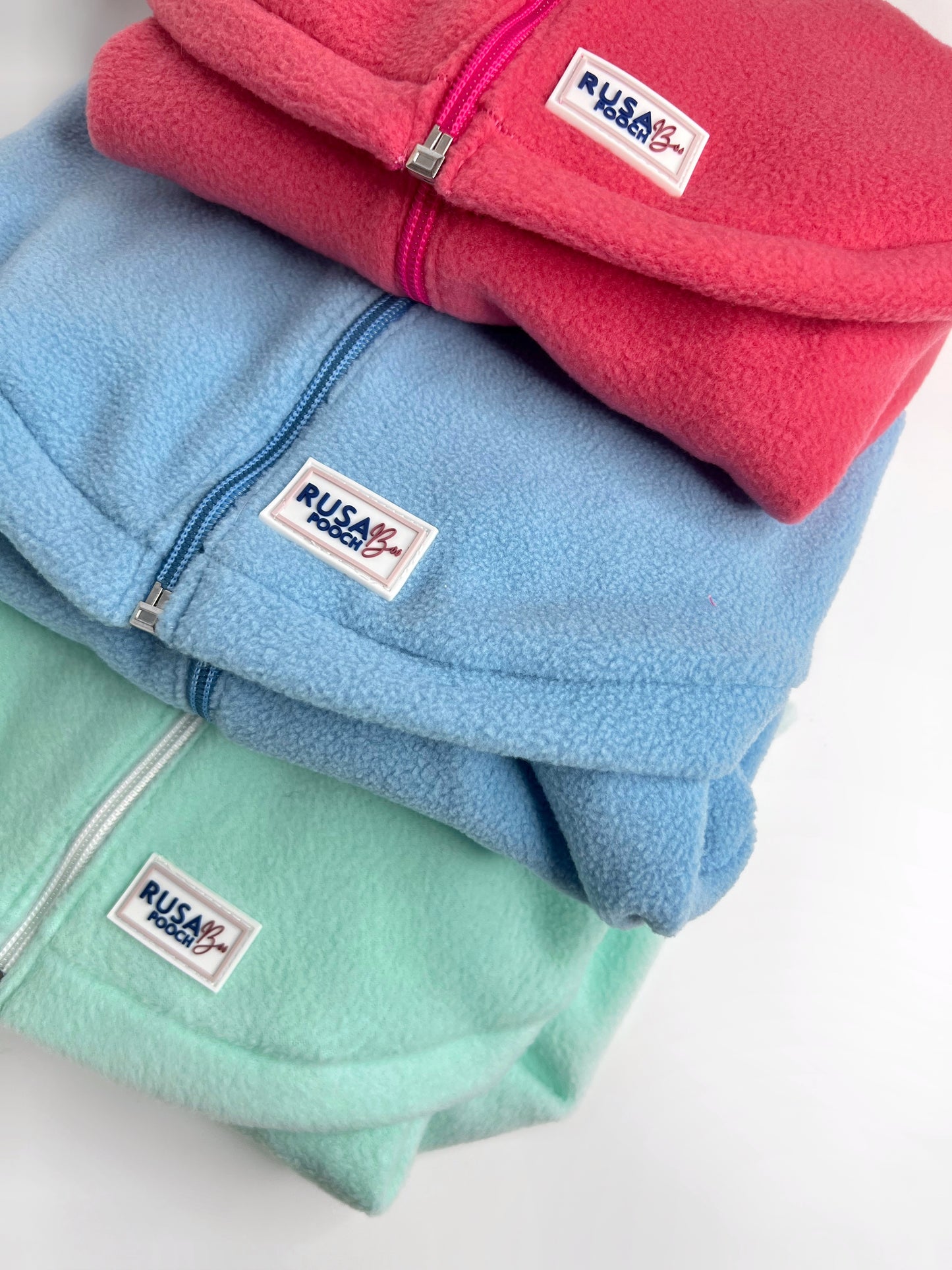 Coral pink, baby blue and mint polar fleeces with zips