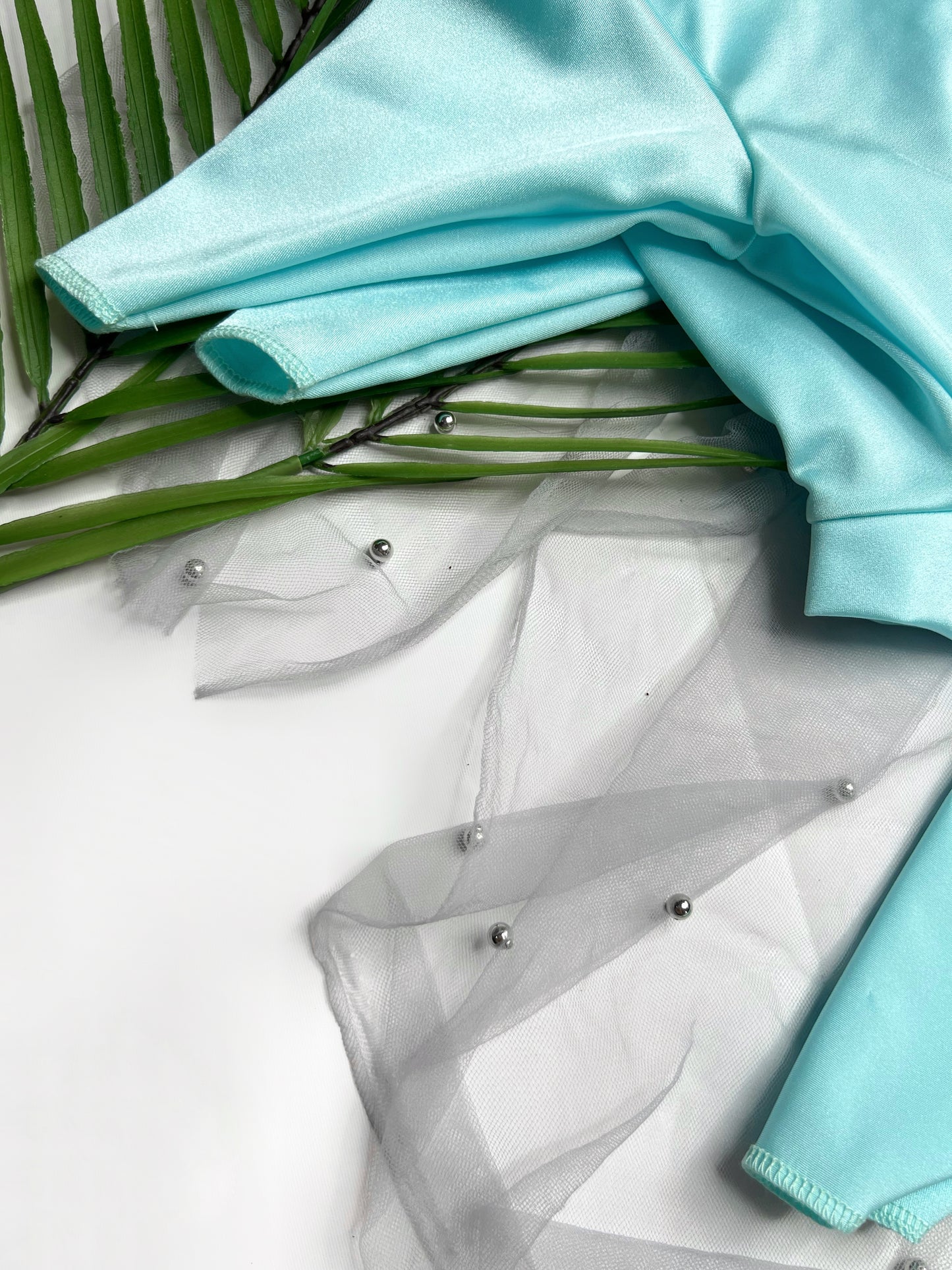 Close up of our aqua blue summer suit for dogs