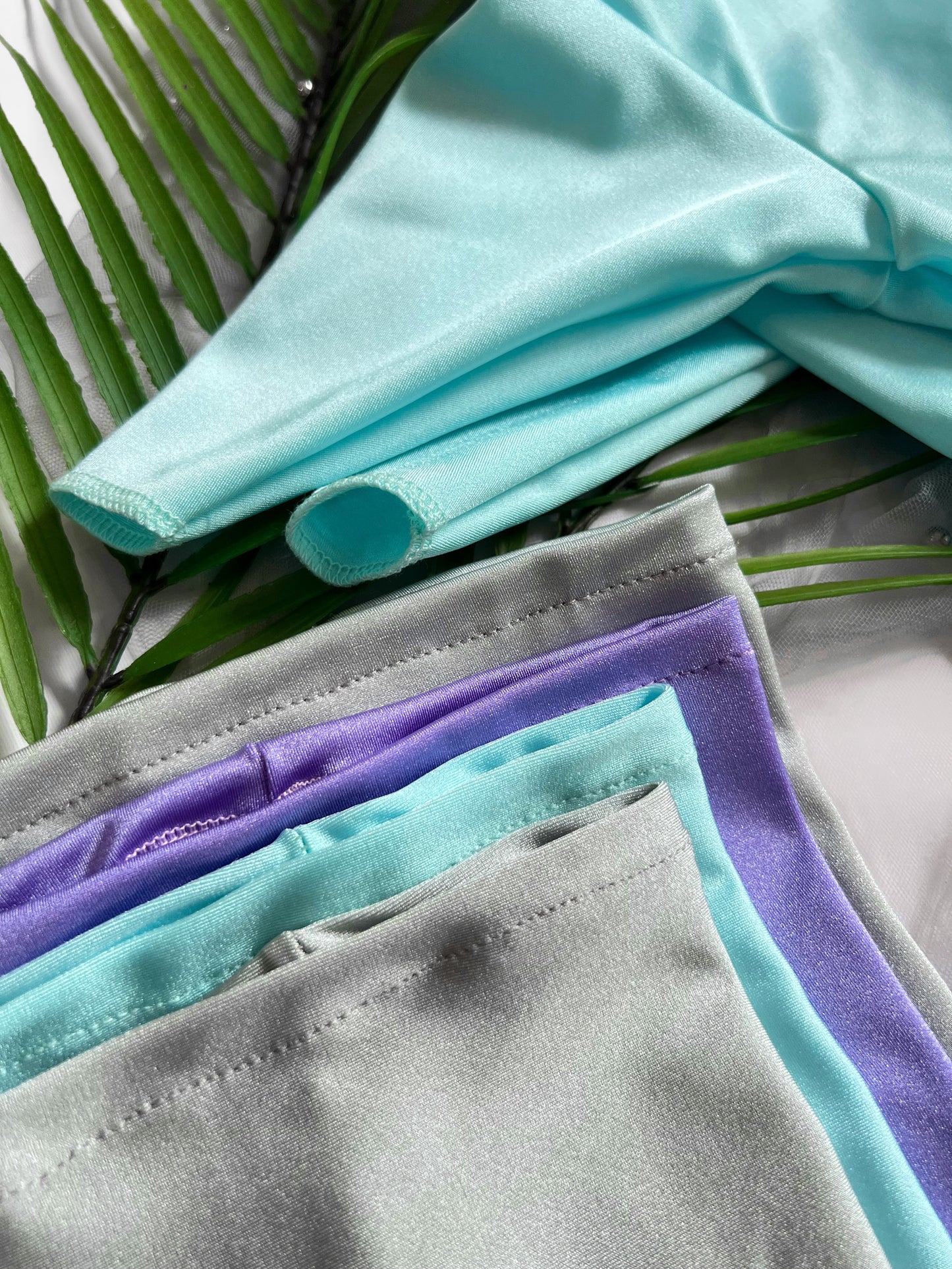 Arms of the aqua summer suit and all coloured snoods