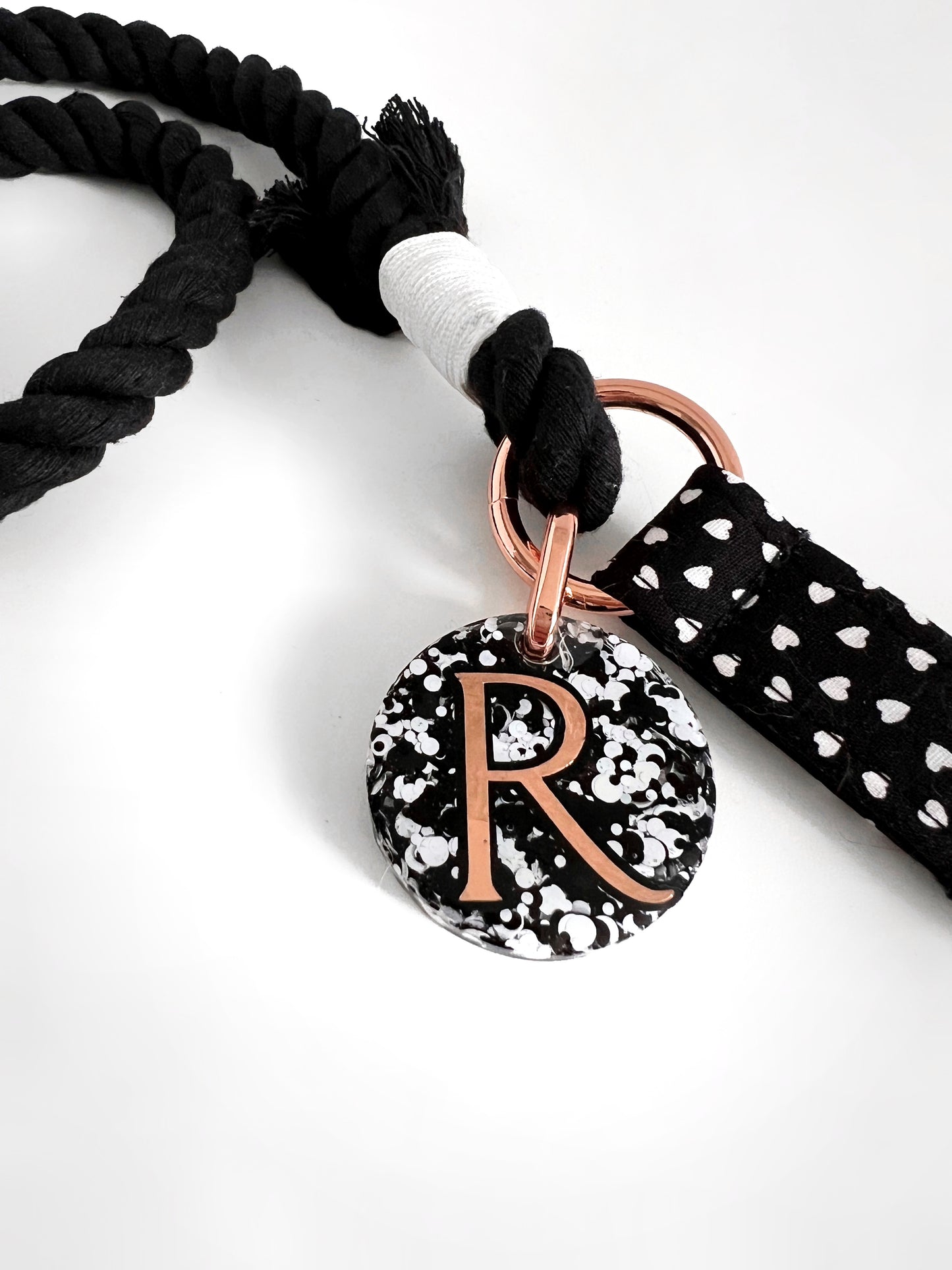 Close up of dark hearts rope lead handle and tag
