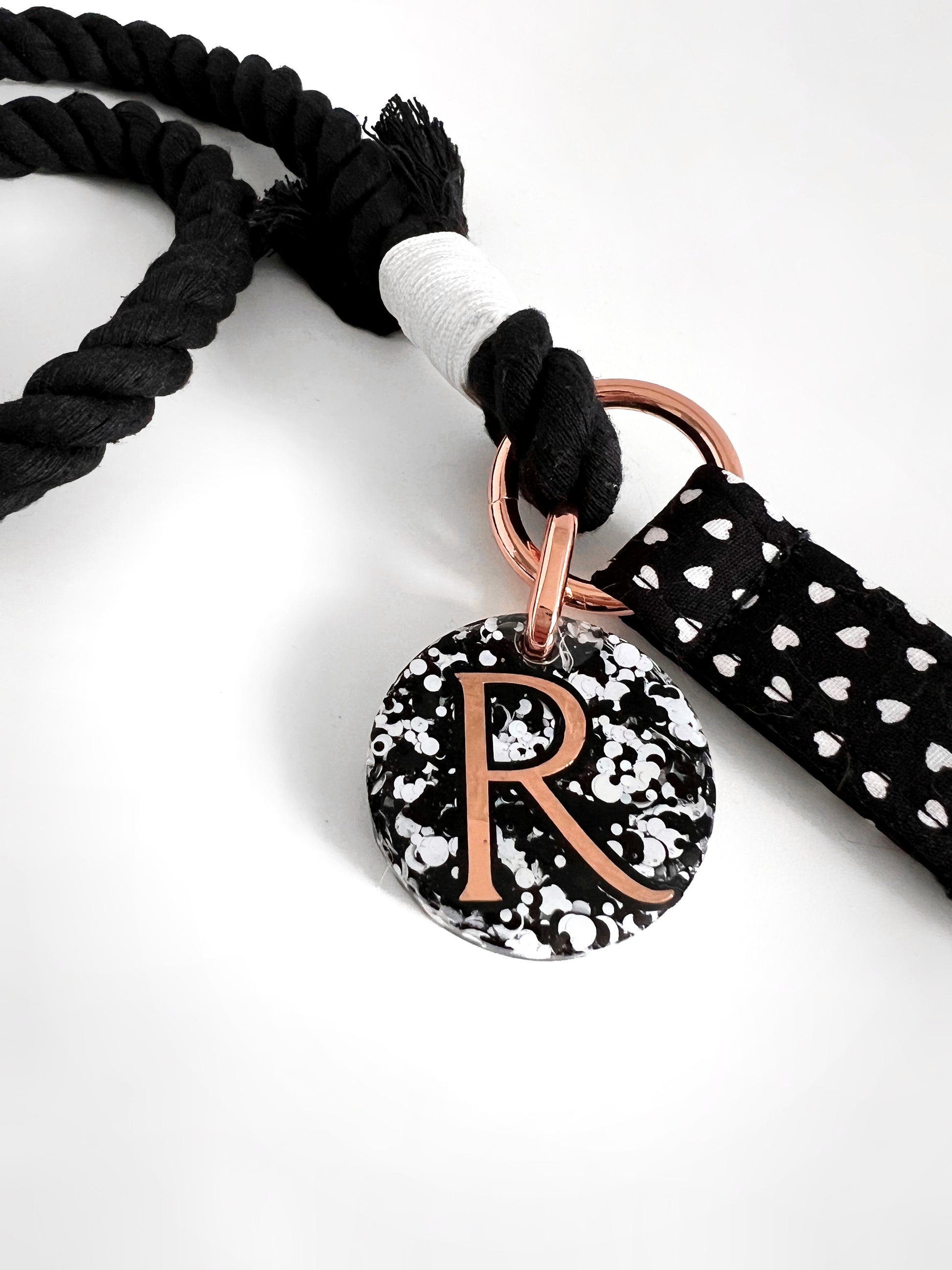 Close up of dark hearts rope lead handle and tag