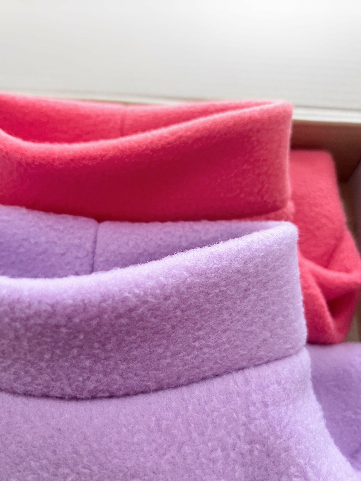 Light purple and coral pink fleeces