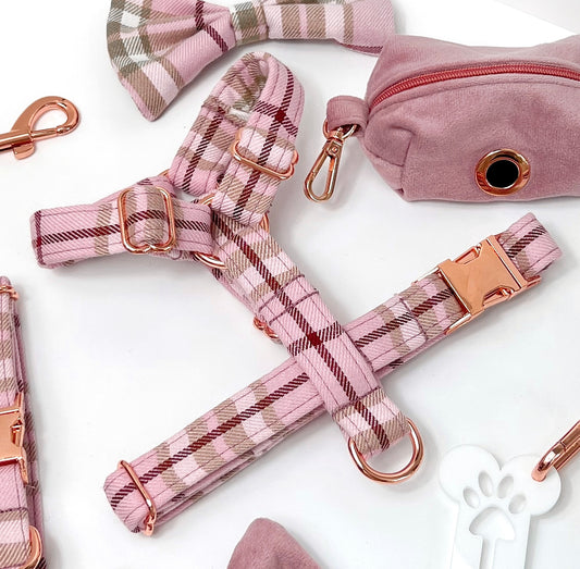 Close up of pink tartan dog harness