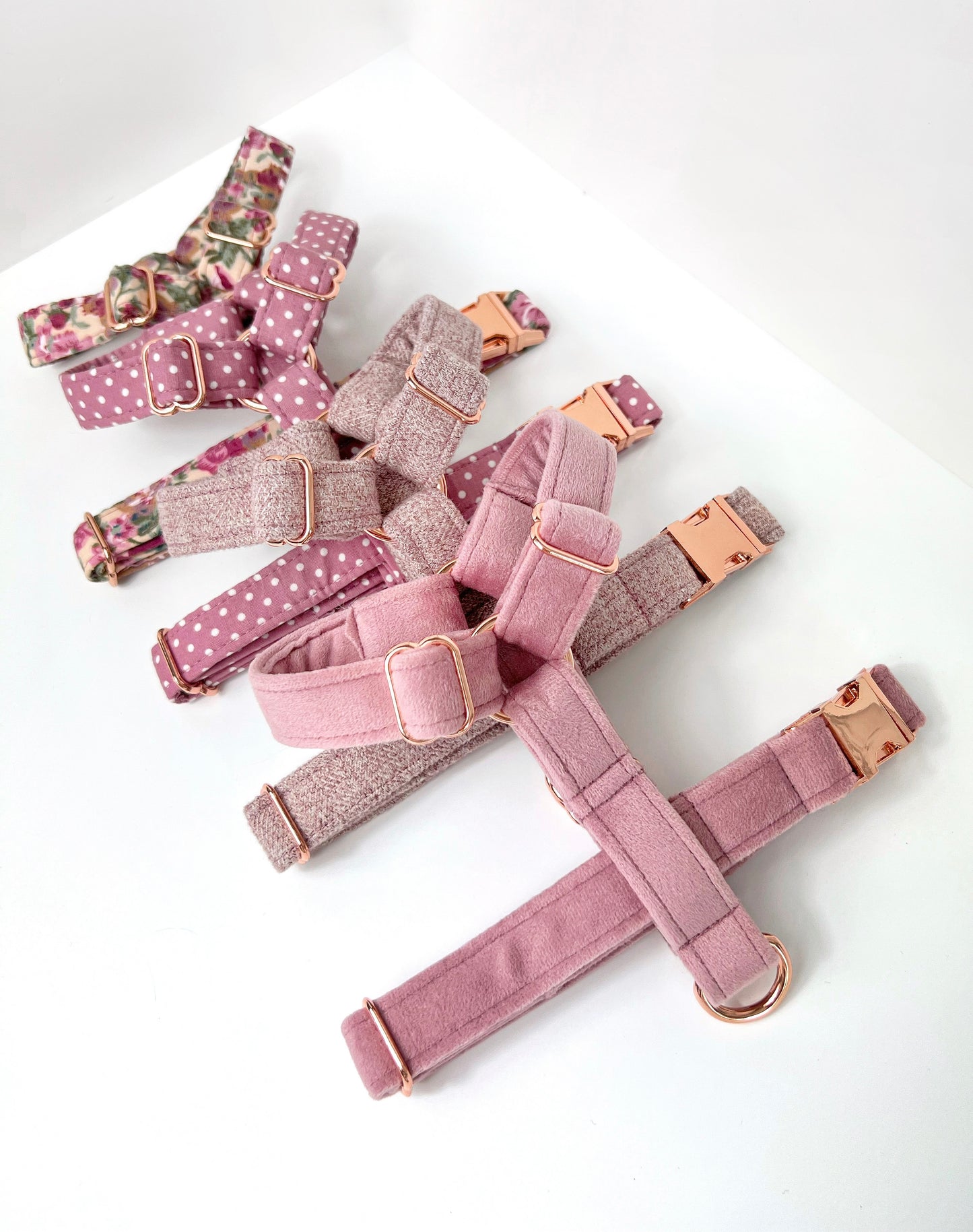 Some of the pink strap harnesses that we stock