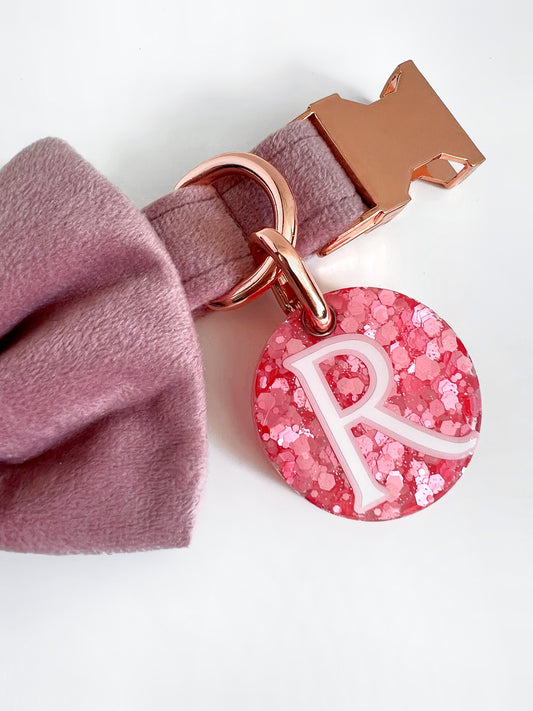 Bright pink glitter dog id tag on a soft pink velvet collar