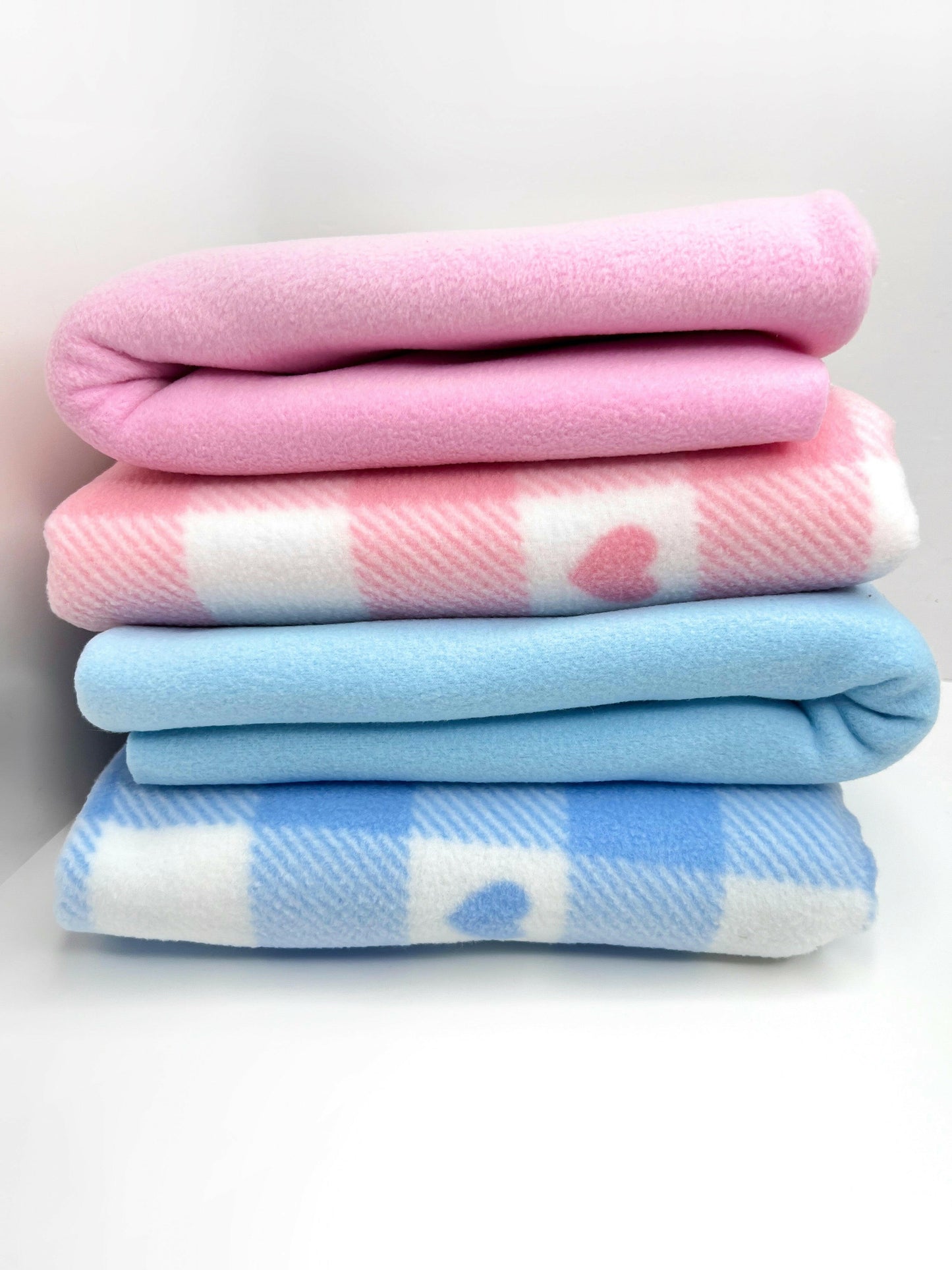 Both pink and blue checked blankets