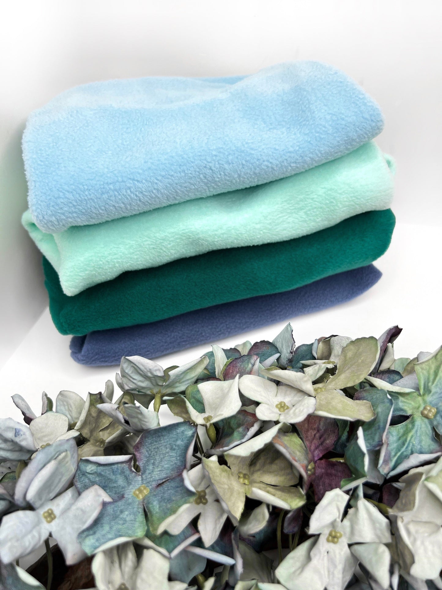 Multiple fleeces showing some of our blue tones of fleece