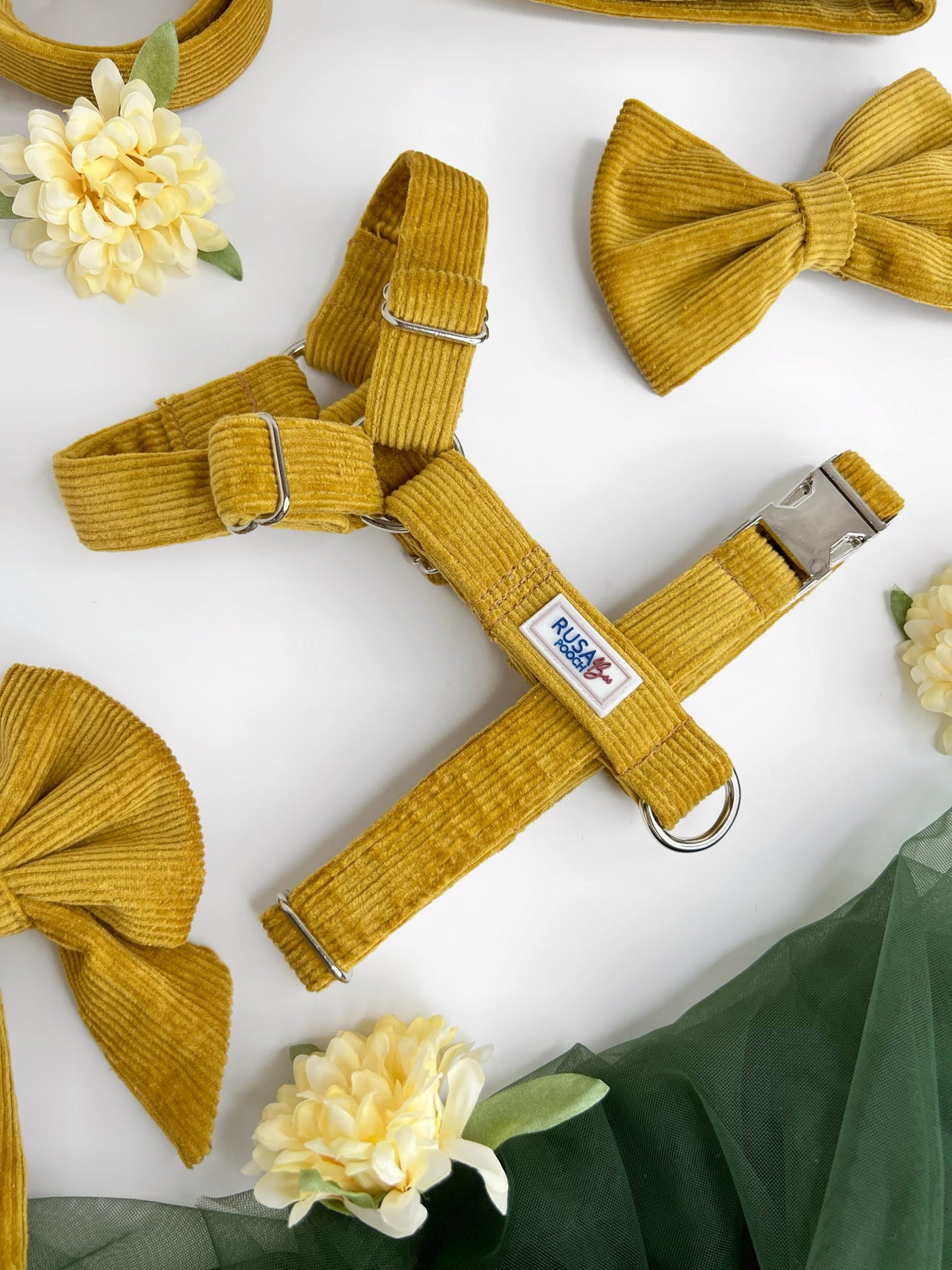 Close up of our mustard cordrouy dog harness in our strap style